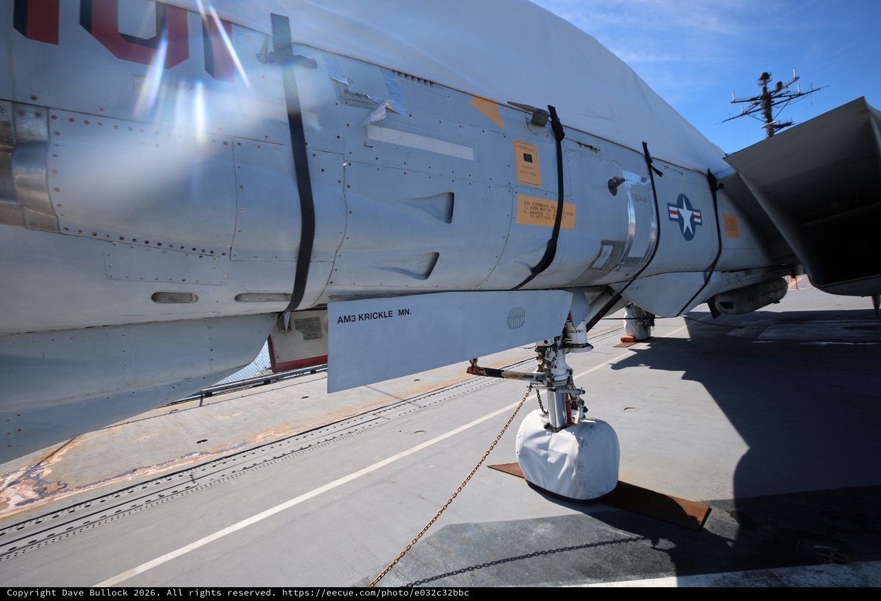 Close-Up of Vintage Military Aircraft Landing Gear and Fuselage