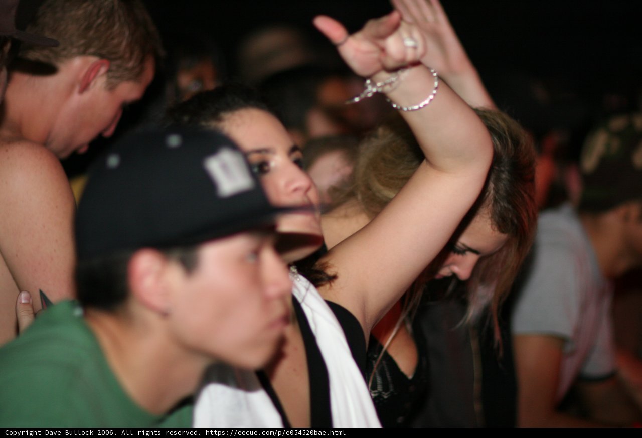 Green-shirted Woman Dancing in Night Club