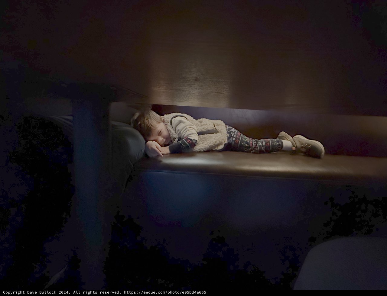 Child Sleeping Peacefully on Living Room Sofa