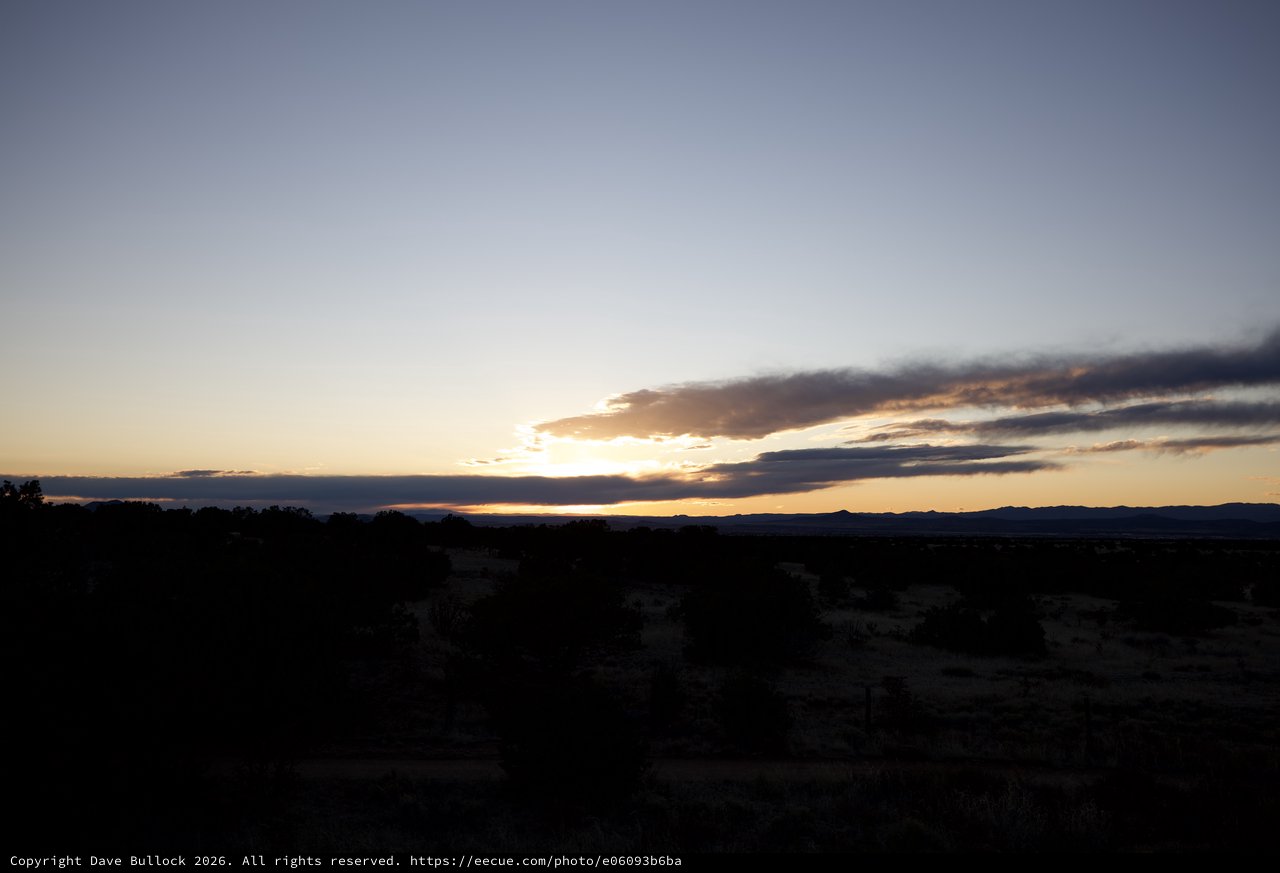 Dramatic Sunset Over Desert Landscape at Twilight