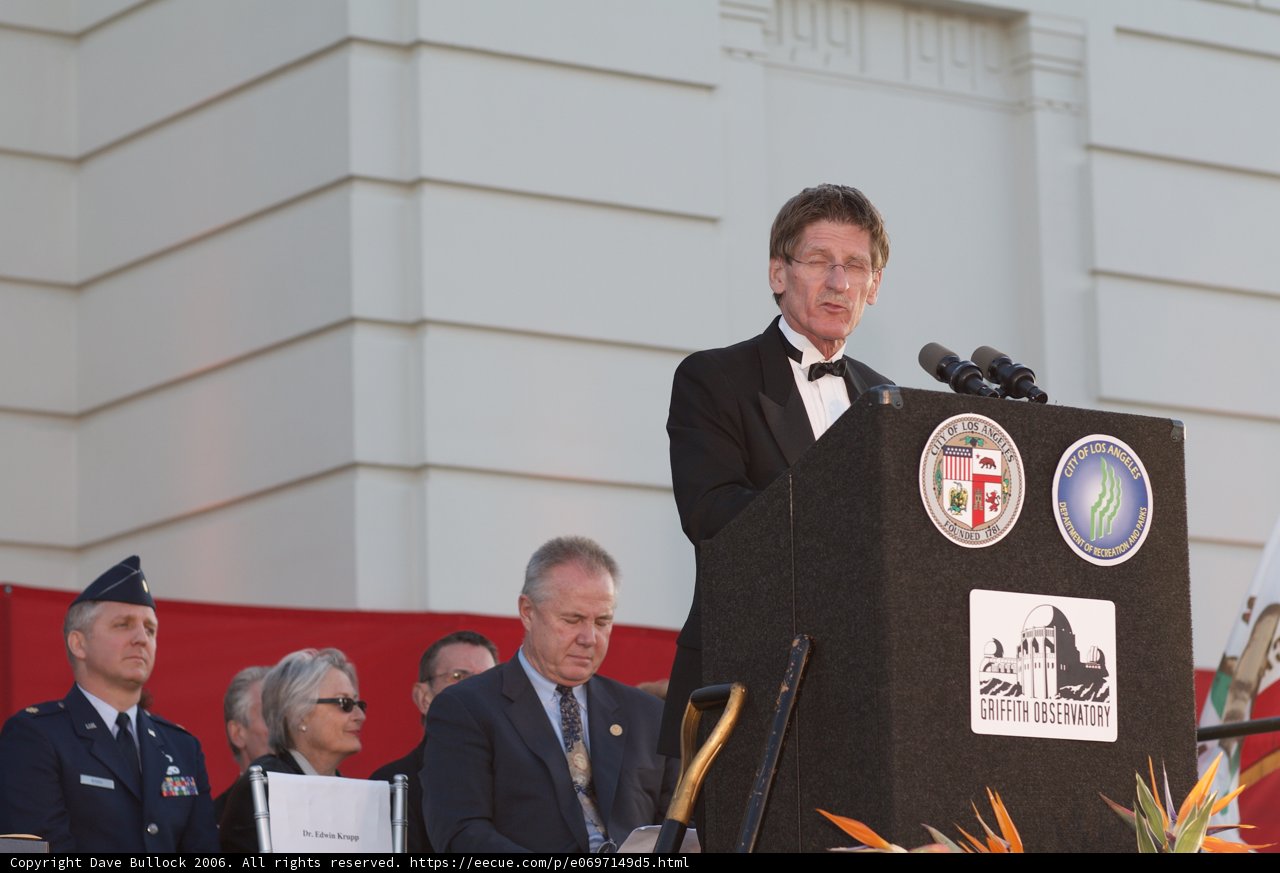 Keynote Speaker Addressing a Crowd at a Formal Event