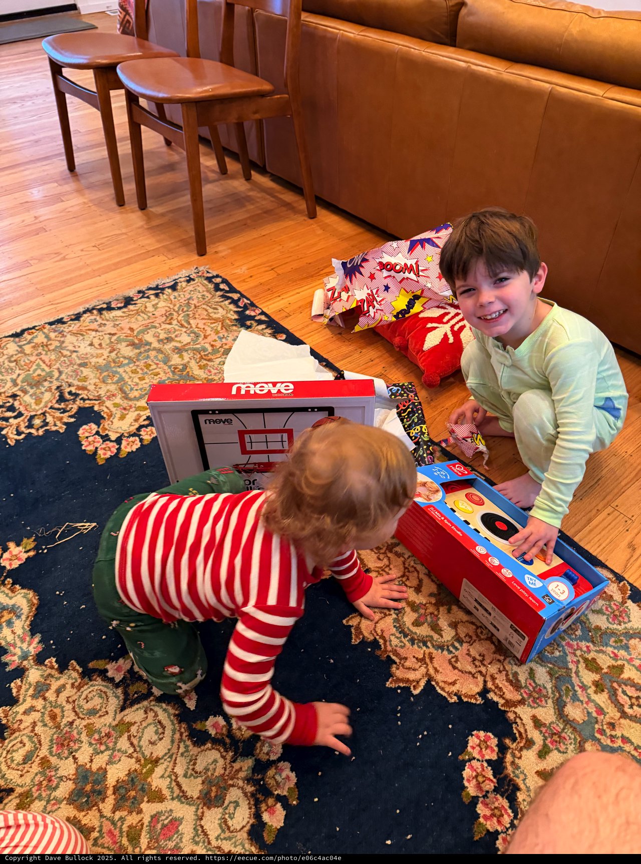 Brothers Playing with Toy Cash Register on Living Room Floor