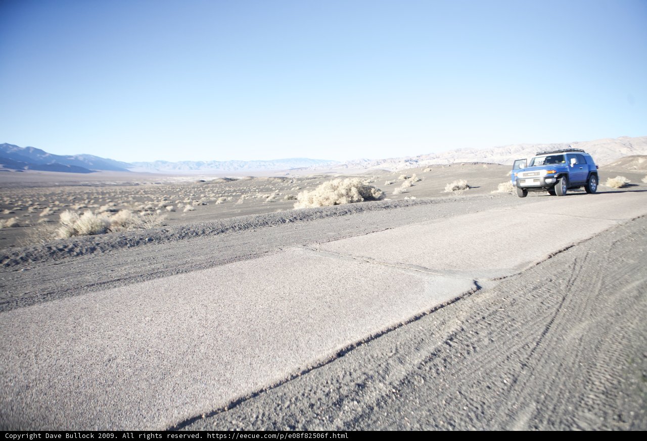 Driving through the Desert in a Blue Jeep