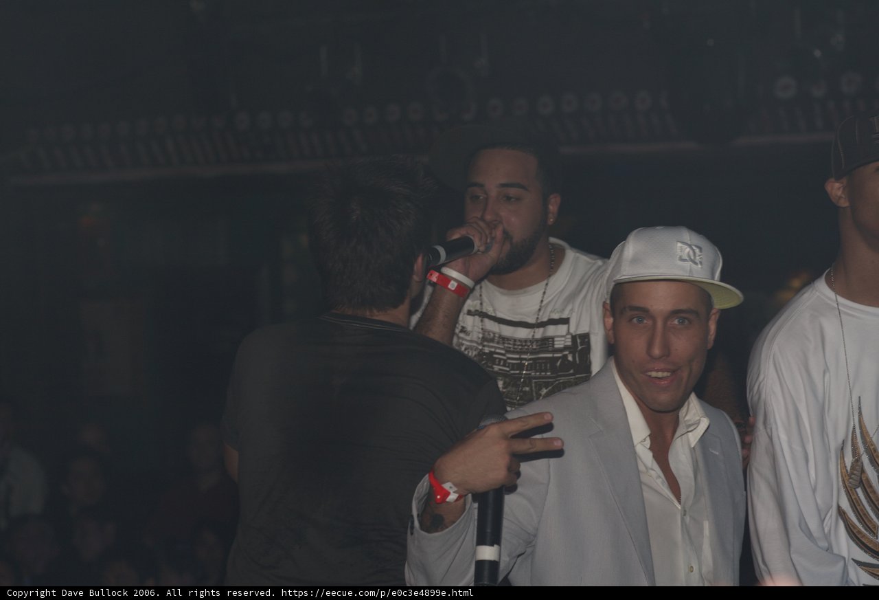White Shirt and Two Hats at the Nightclub