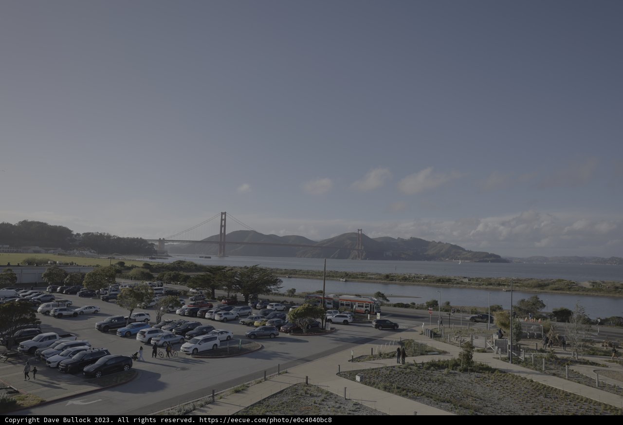 Bridge Over a Bustling Parking Lot