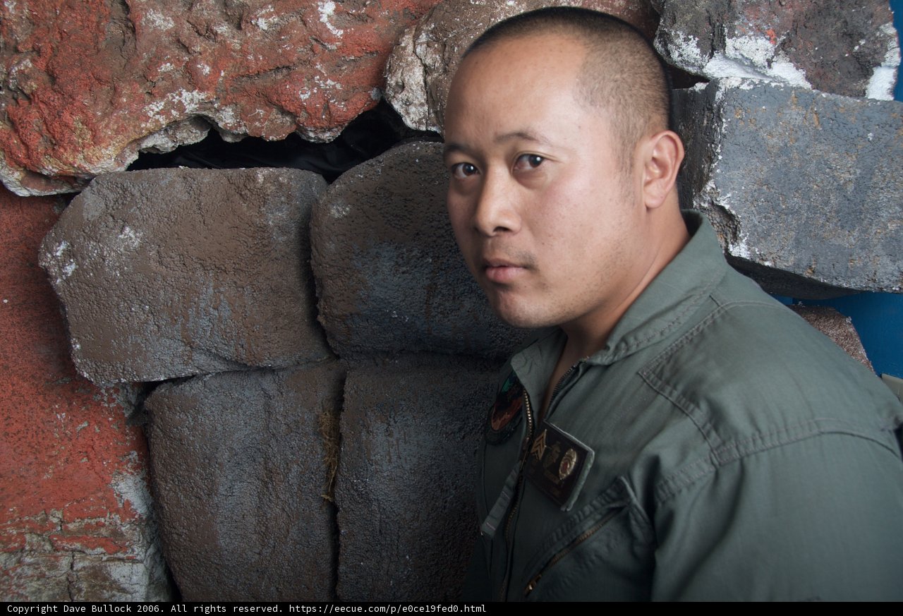 Military Man Standing Tall Against the Wall