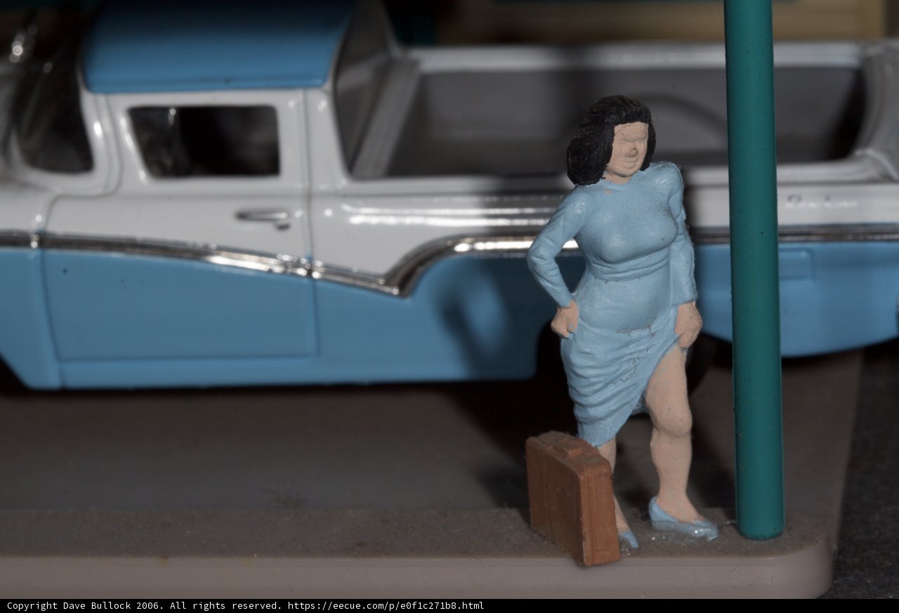 Woman Figurine and Blue Truck