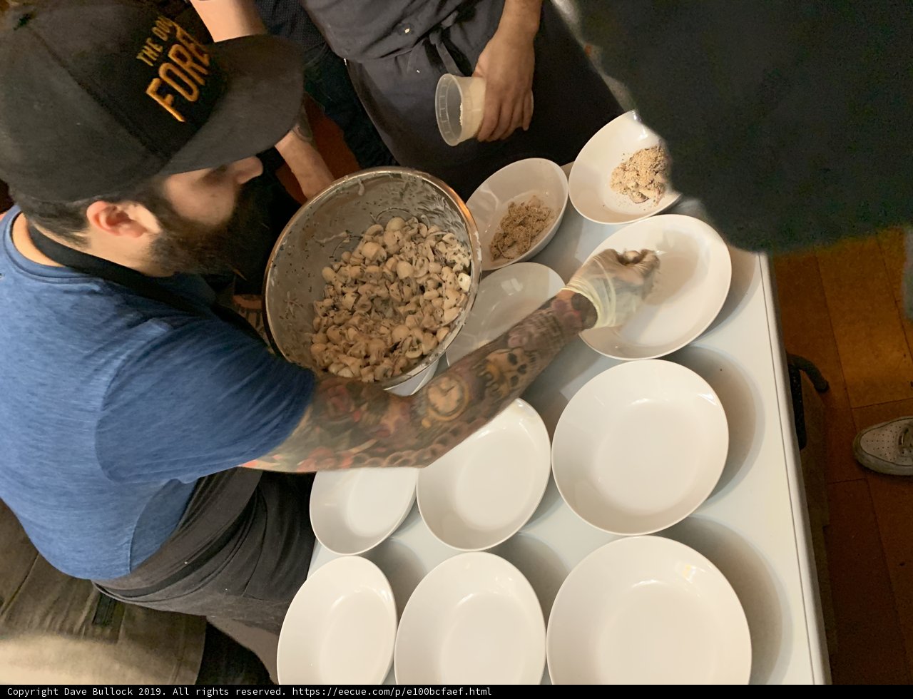 Tattooed Man Preparing a Meal
