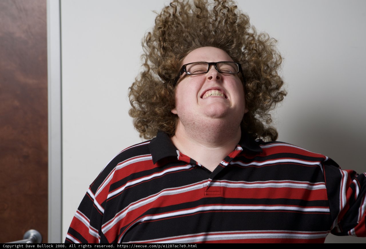 Curly-haired man with a smile