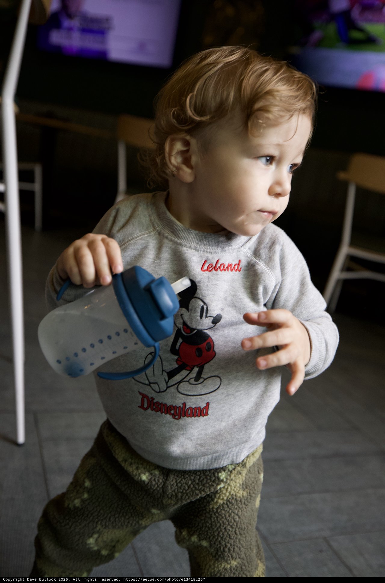 Toddler with Baby Bottle in Disneyland Sweatshirt