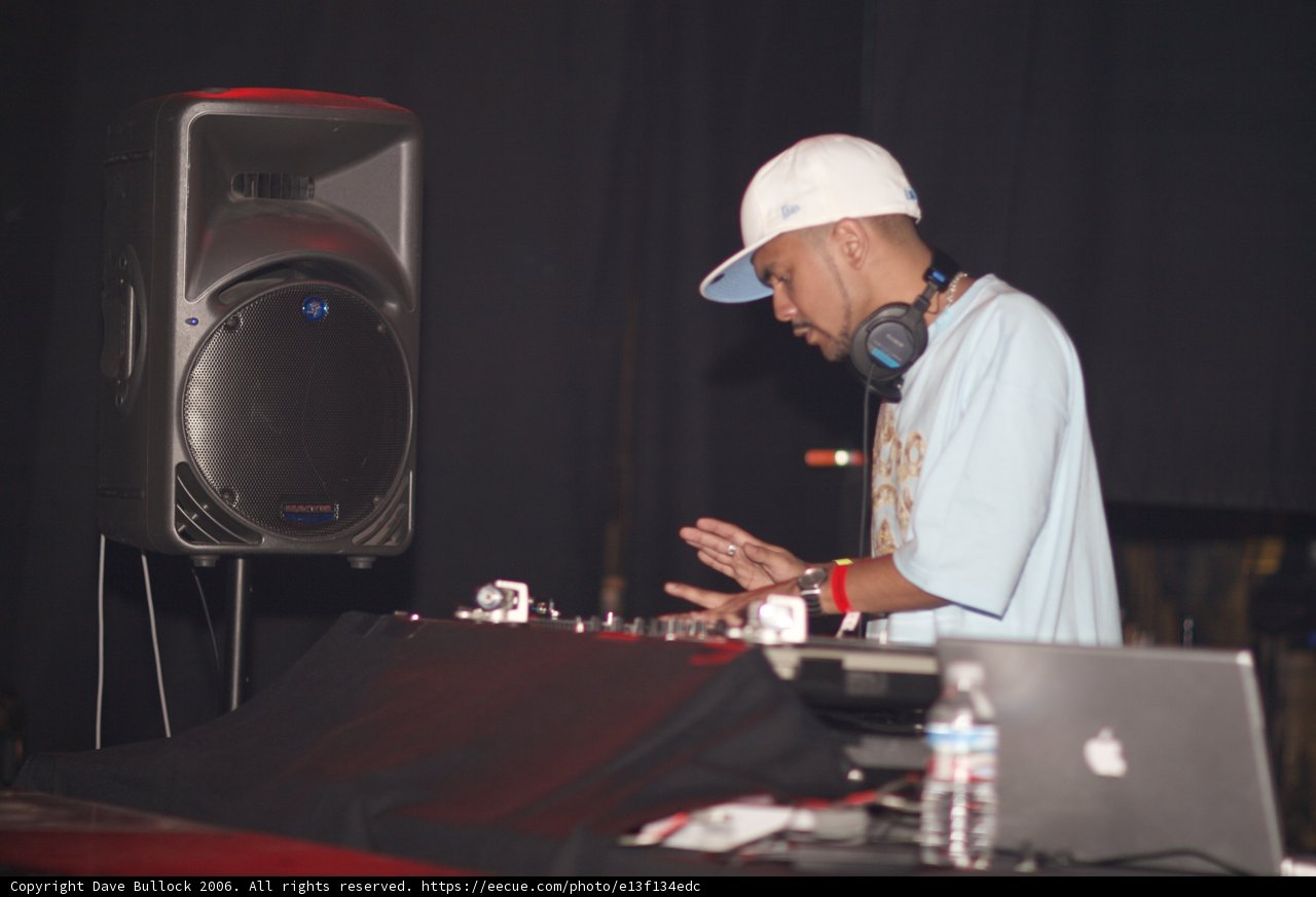 Blue-Shirted Deejay with Hat and Headphones