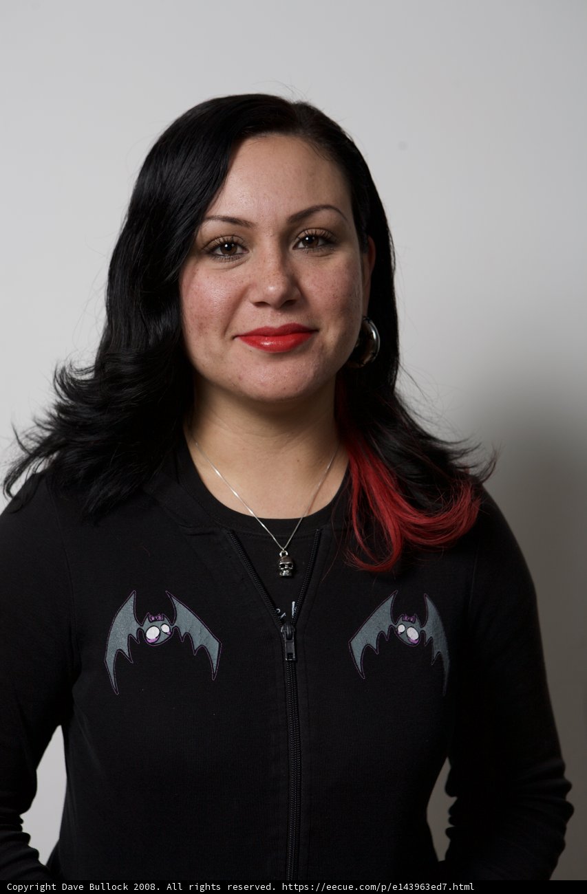 Red-Headed Artistic Woman in a Black Knit Jacket