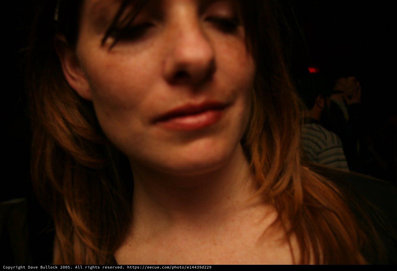 Candid Close-Up Portrait at a Dimly Lit Venue