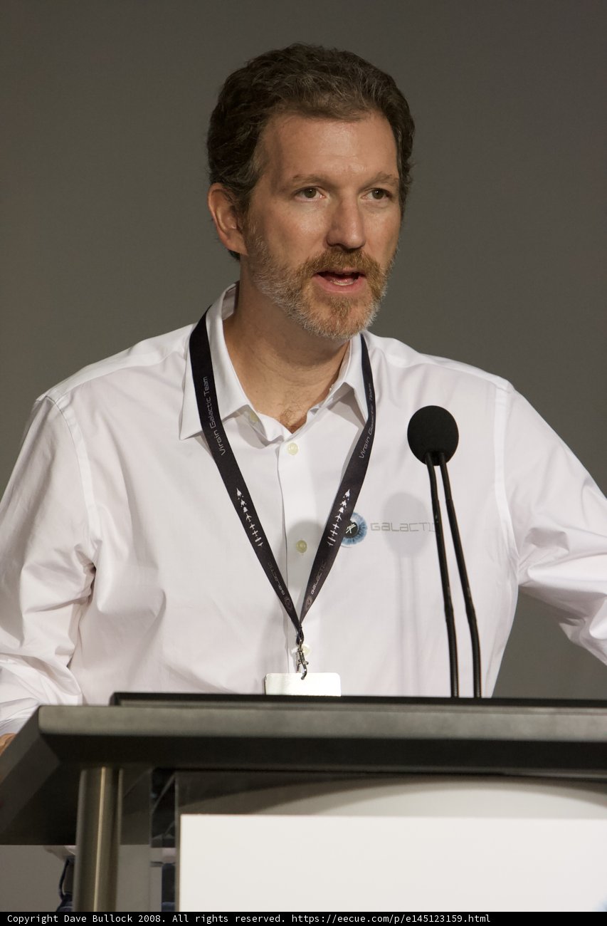 Man Giving Enlightening Lecture at Podium