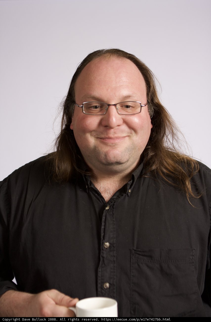 Portrait of Ethan Zuckerman holding a coffee cup