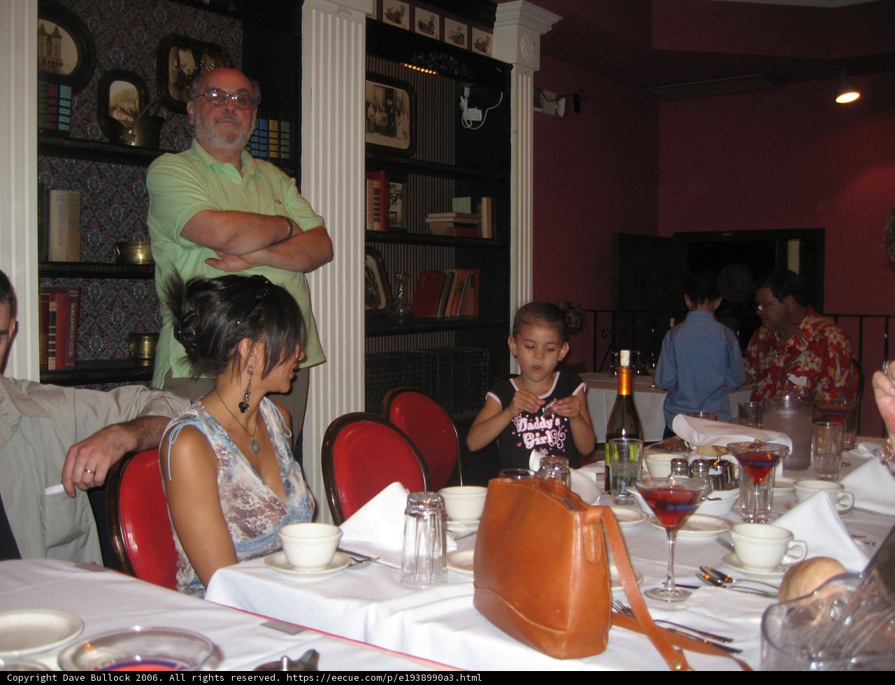 Man in a Green Shirt Dining in a Restaurant