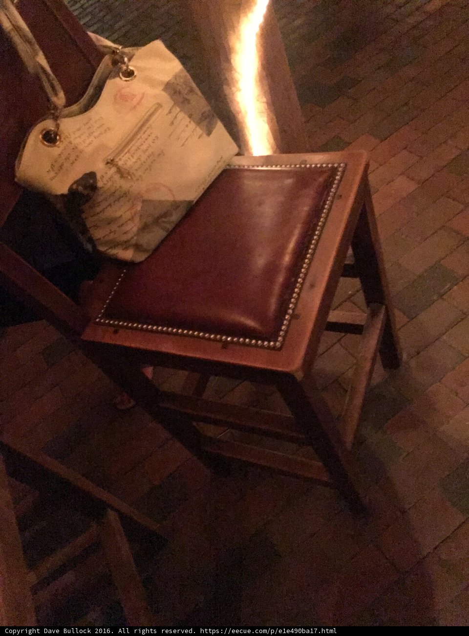 Chair and Purse on Brick Floor