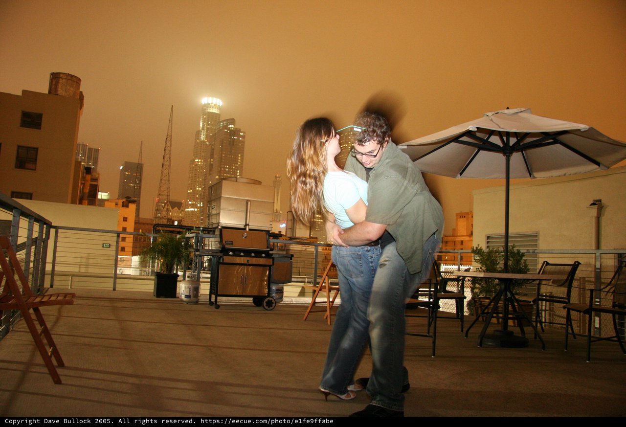 Rooftop Romance Under an Orange Night Sky