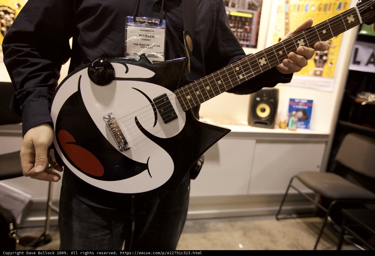 Electric Guitar and a Smiling Musician