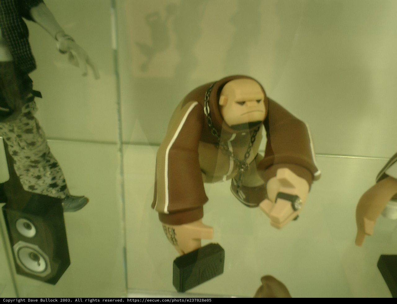 Man admiring accessories and figurines at the Tokyo Metropolitan Government Office display case