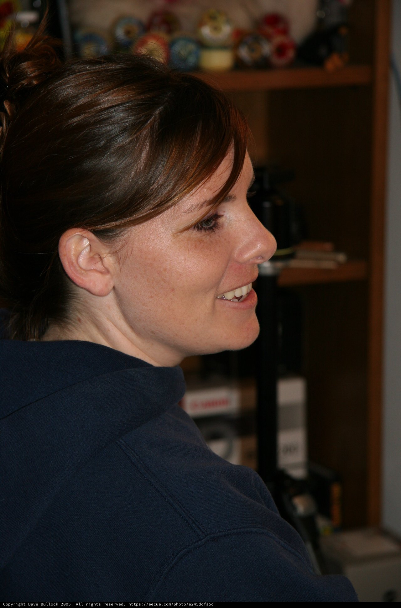 Candid Profile Portrait of Smiling Woman Indoors