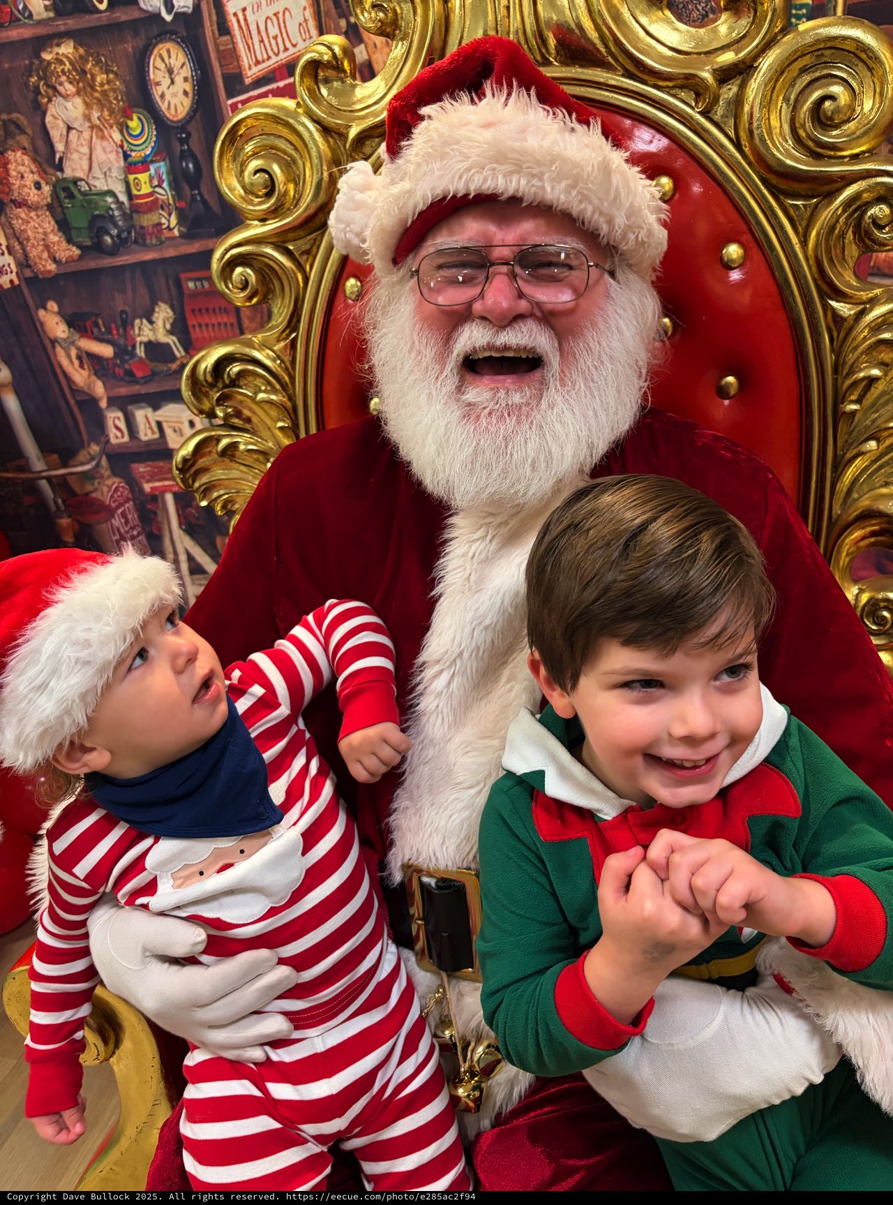 Two Children Visit Santa in His Festive Workshop