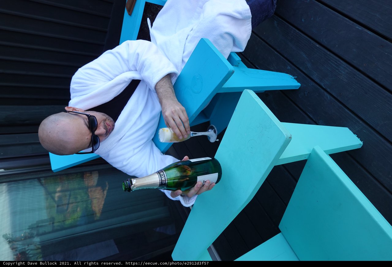 Dave Enjoying Champagne in Bathrobe Outdoors