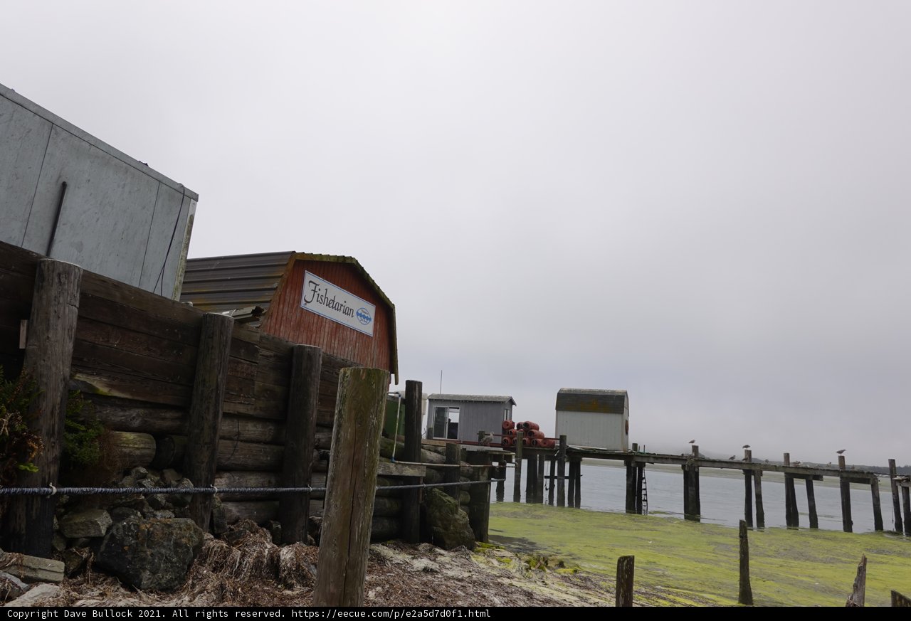 Wooden Pier with Waterfront Building