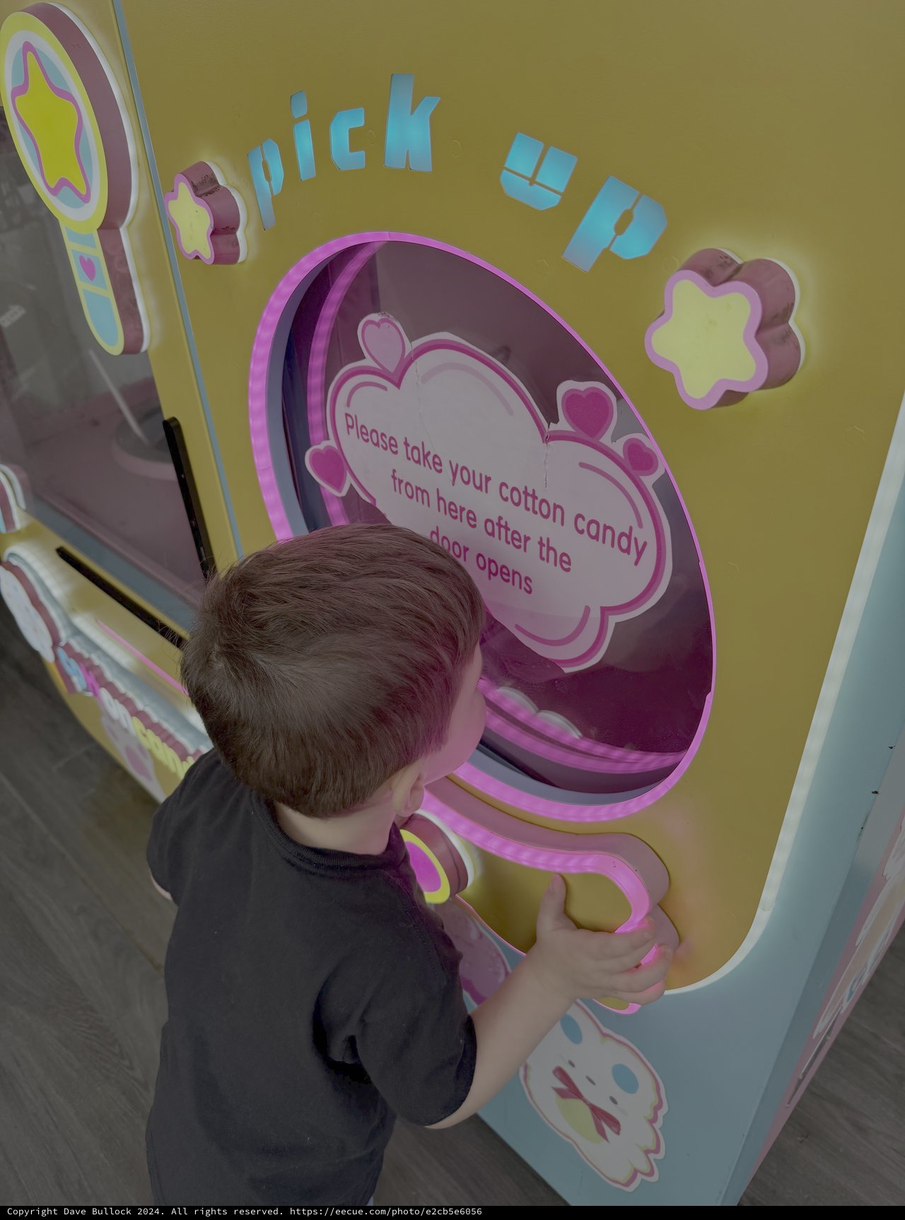Child Using Interactive Cotton Candy Dispenser