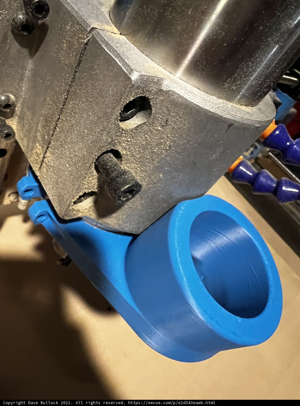 Blue Pipe and Metal Bracket