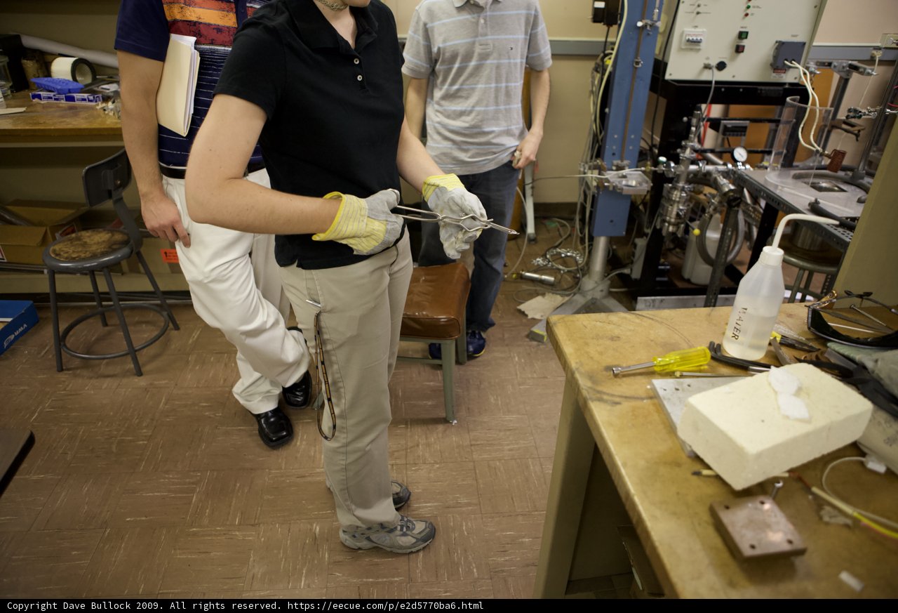 Black Shirted Woman in a Factory