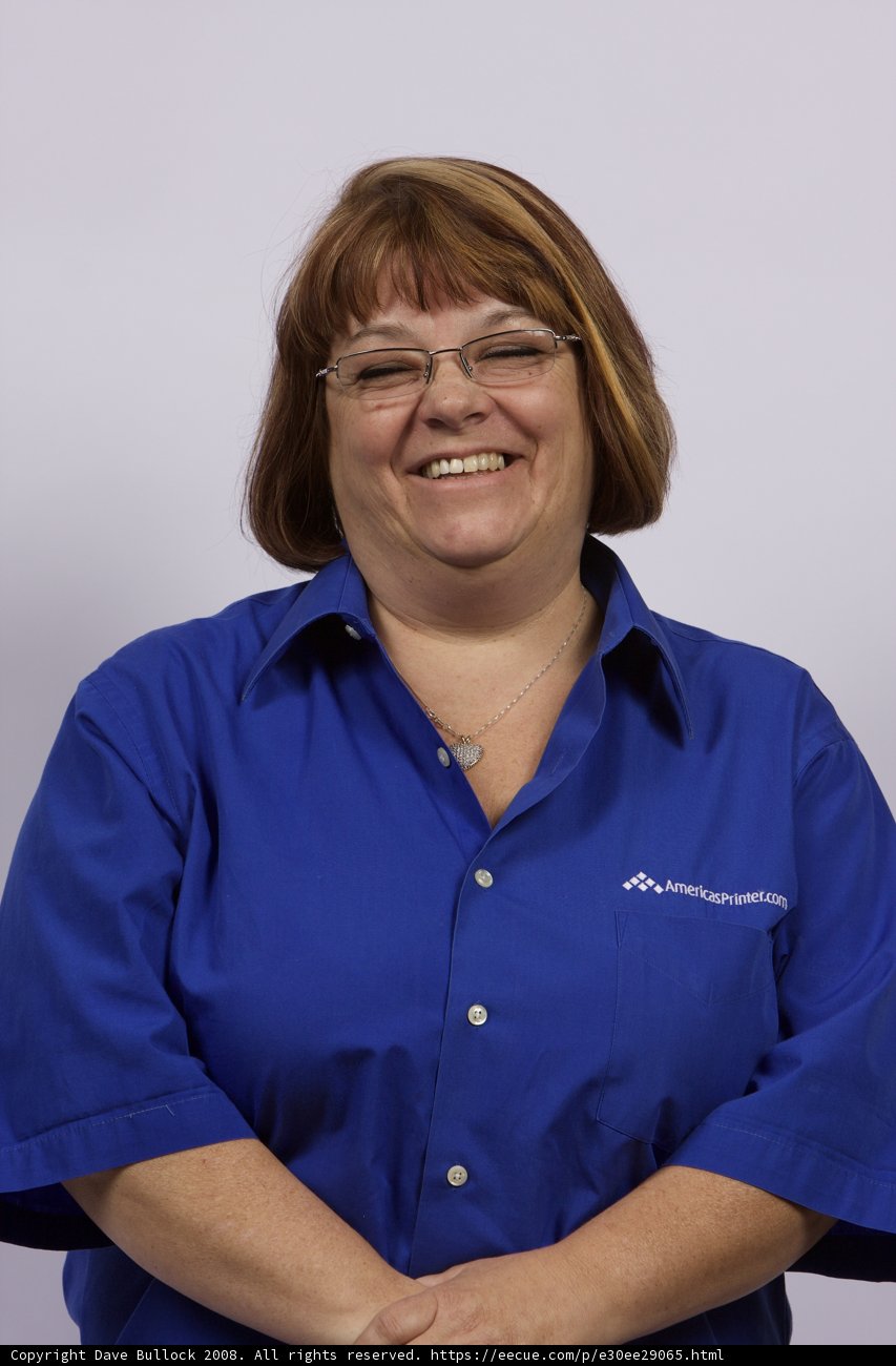 Happy Woman in Blue Shirt and Glasses