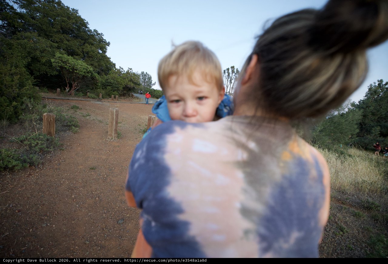 Mother and Toddler on Dusty Trail at Dusk