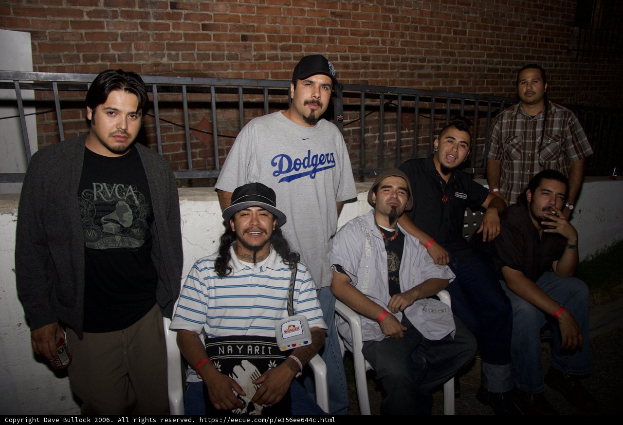 Group of Men Flaunting Their Fashionable Headgear