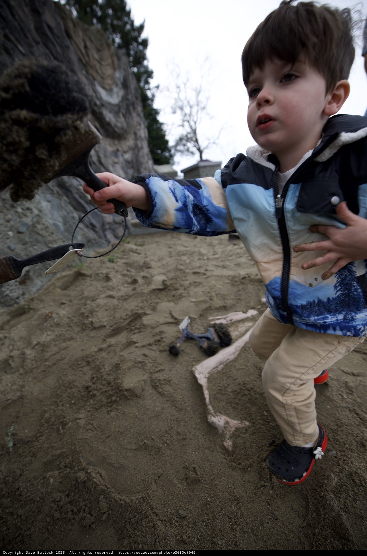 Young Boy Explores Sandy Beach at Low Tide