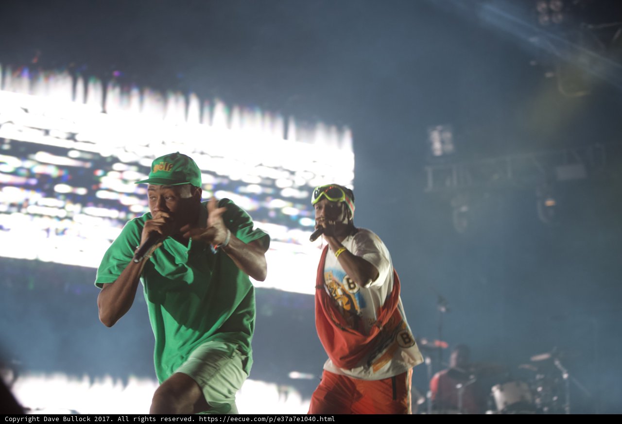 Green-clad performers rocking the stage