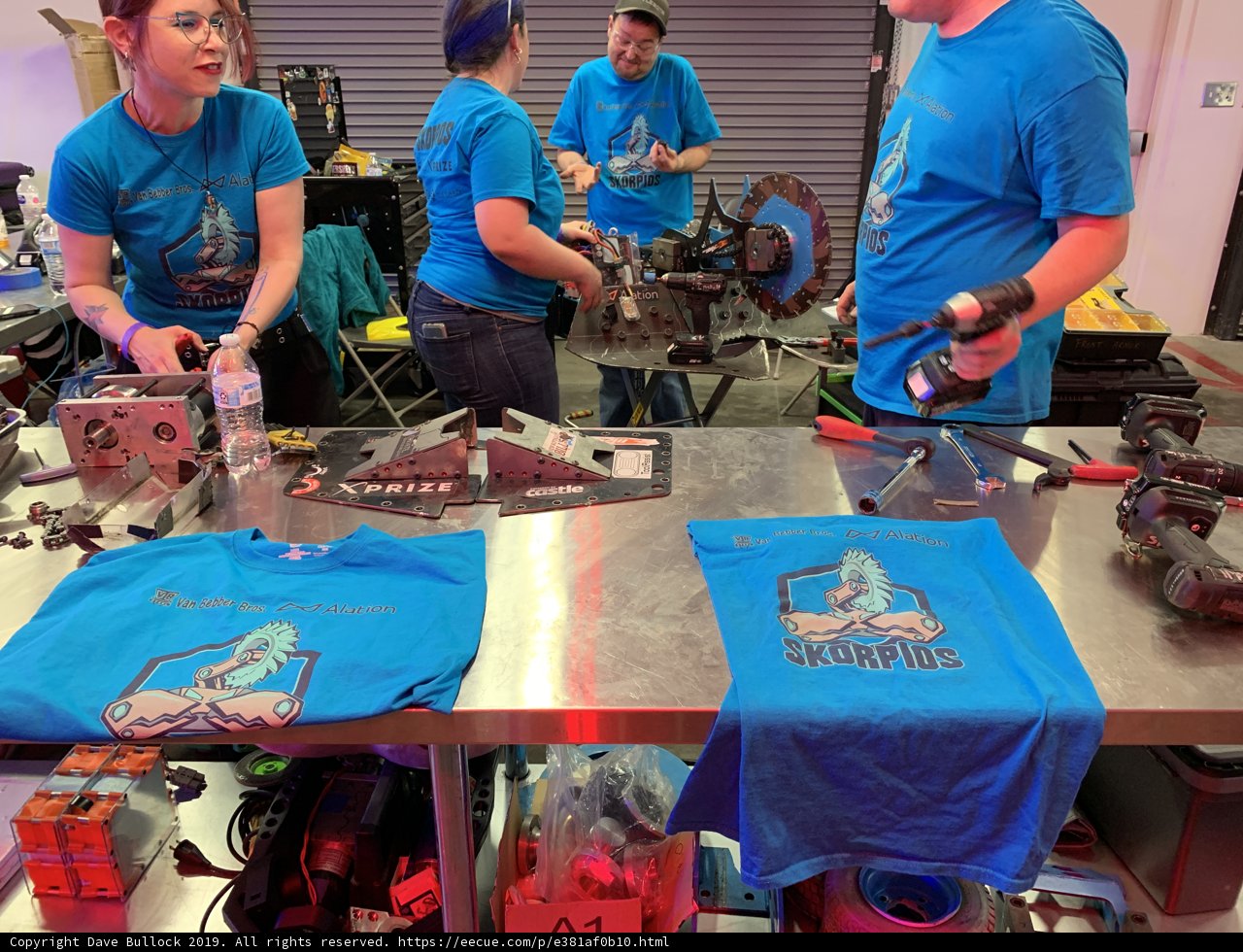 Factory Workers Assembling Machine