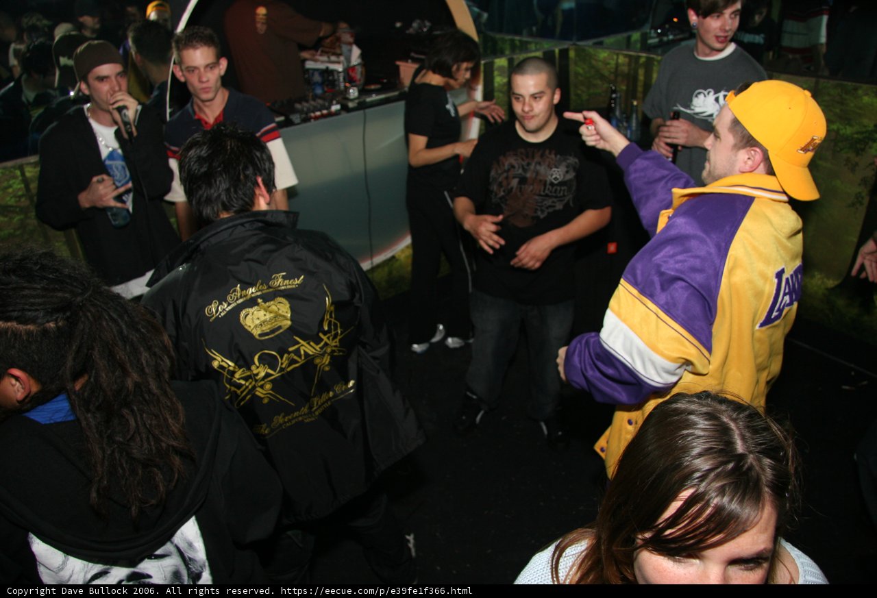 Man in a Bright Yellow Jacket in the Crowd