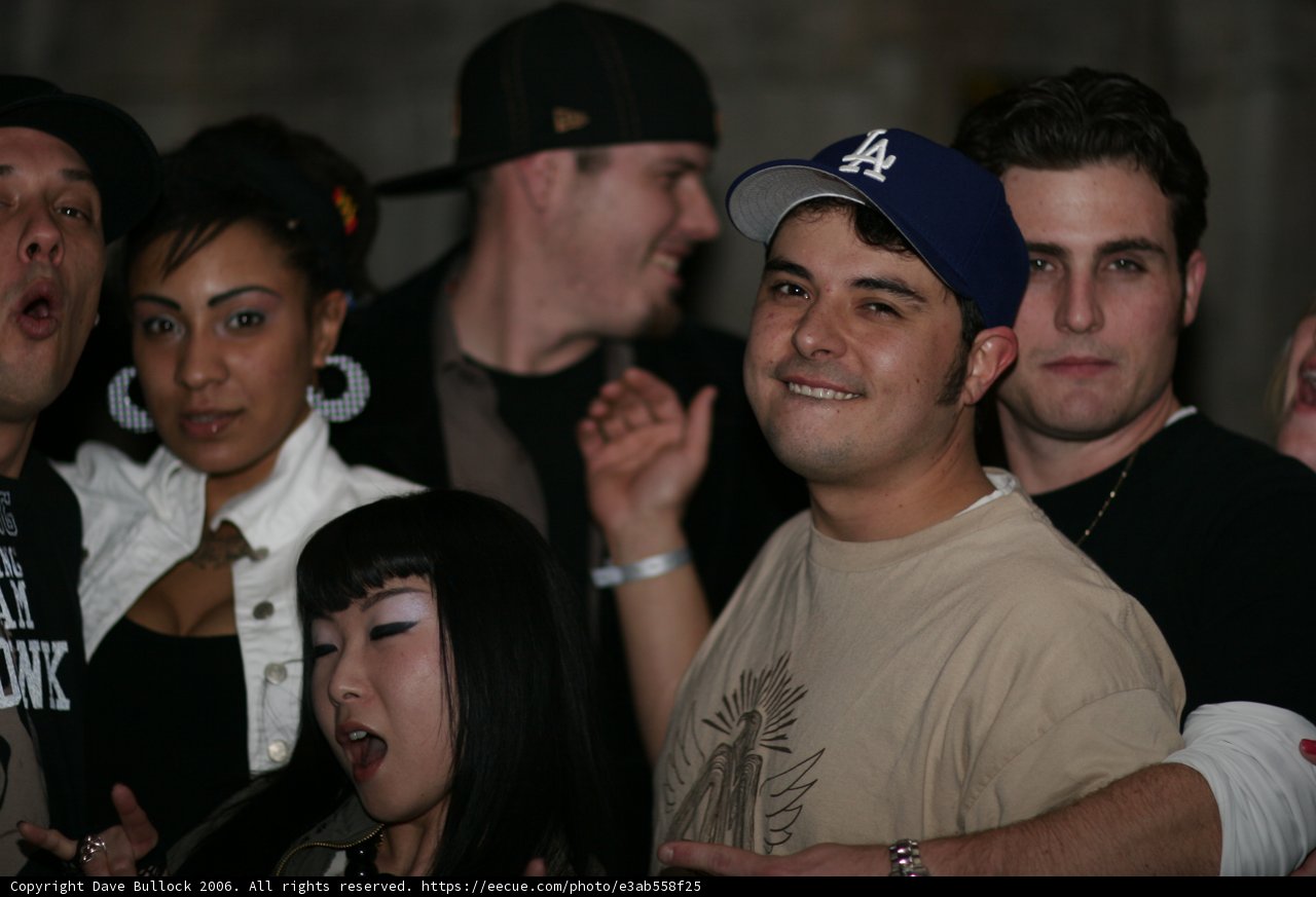 Urban Crowd at Club with Baseball Caps