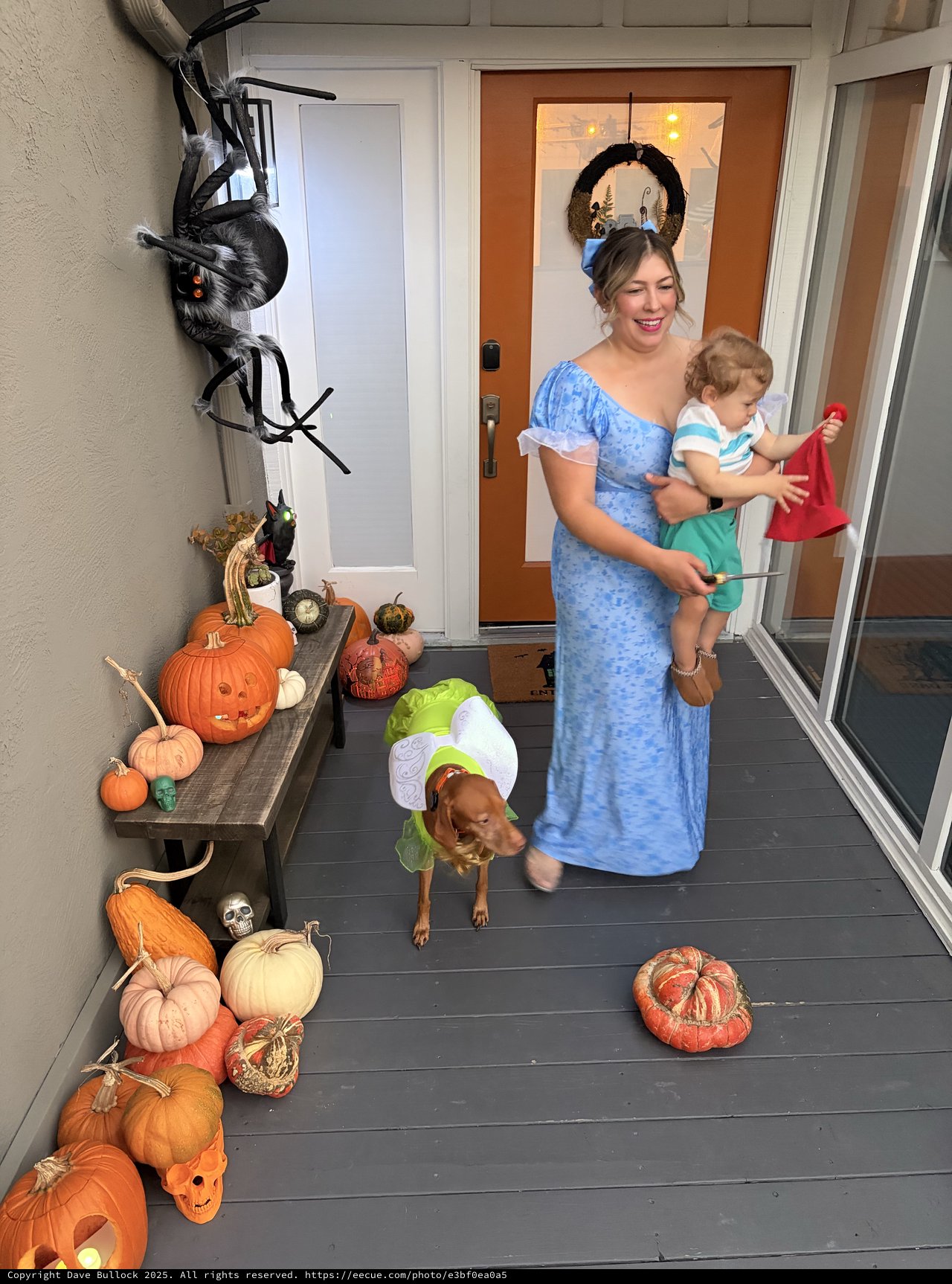Halloween Porch Display with Family in Costume