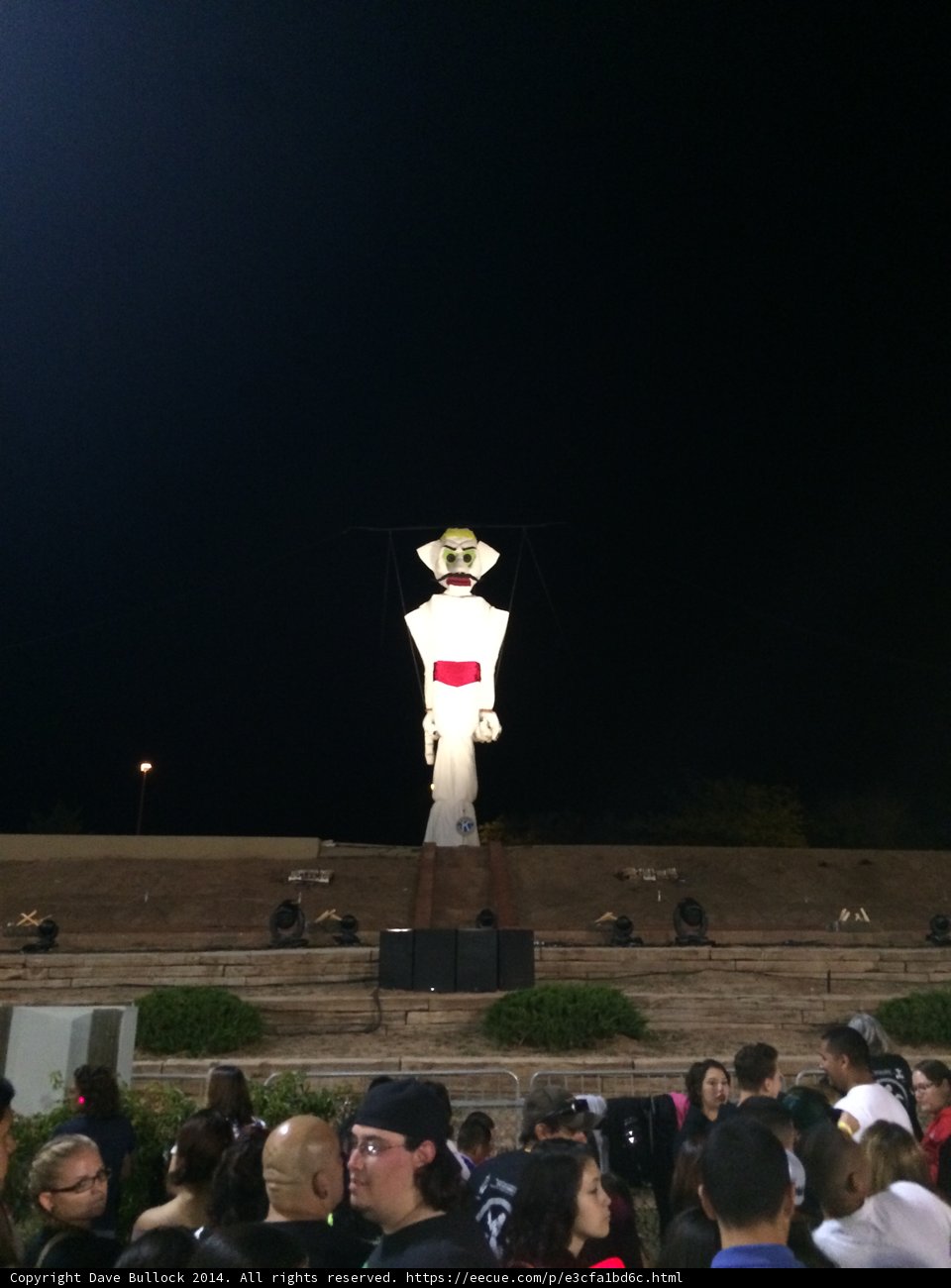 Man with the Hat atop the Building