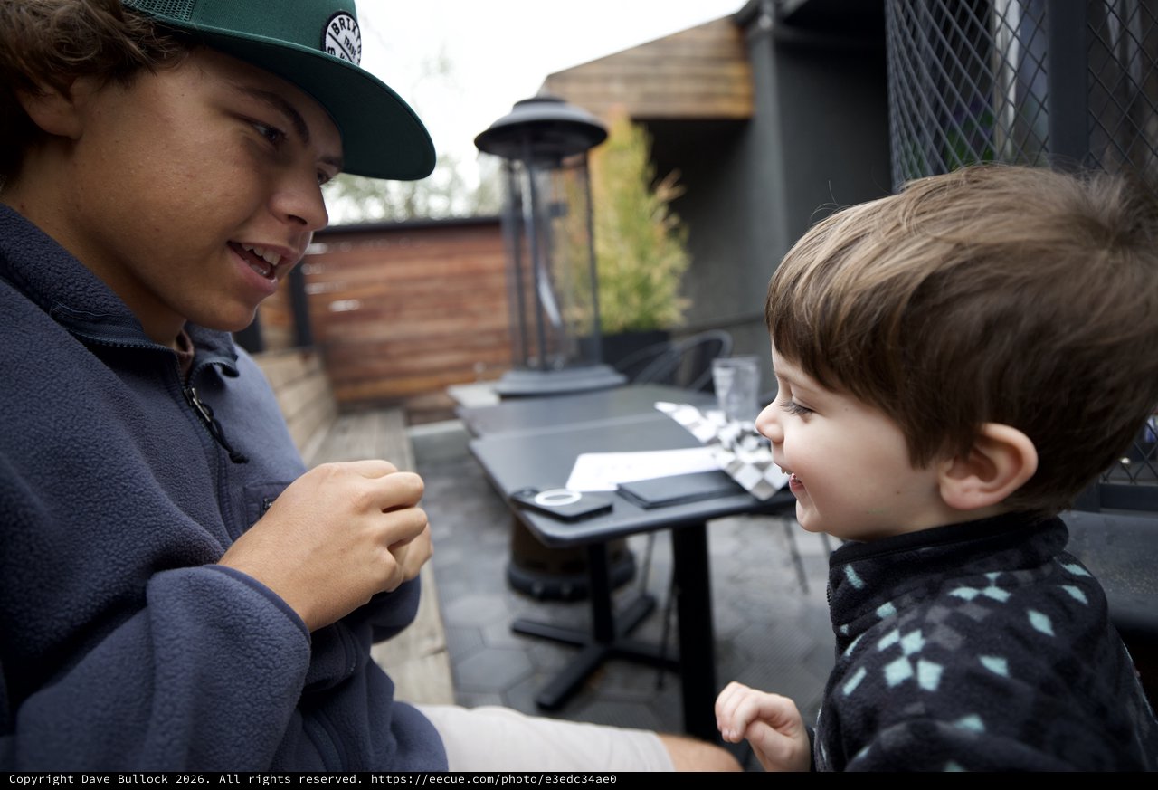 Brothers Sharing a Moment on an Outdoor Patio