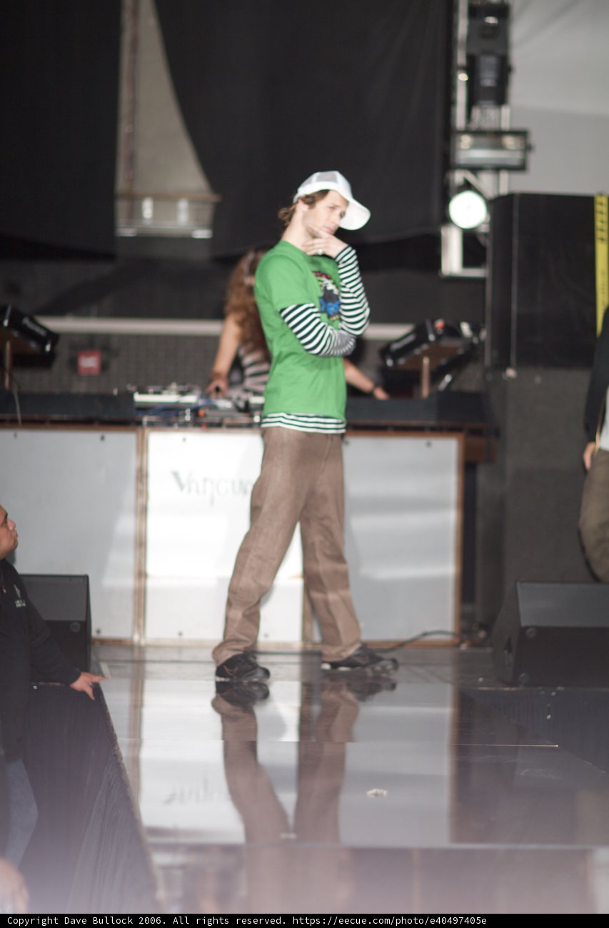 Green Shirt and White Hat on the Music Stage