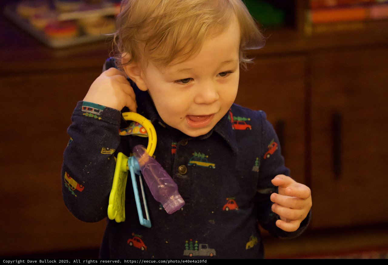 Toddler Playing with Toy Keys at Christmas