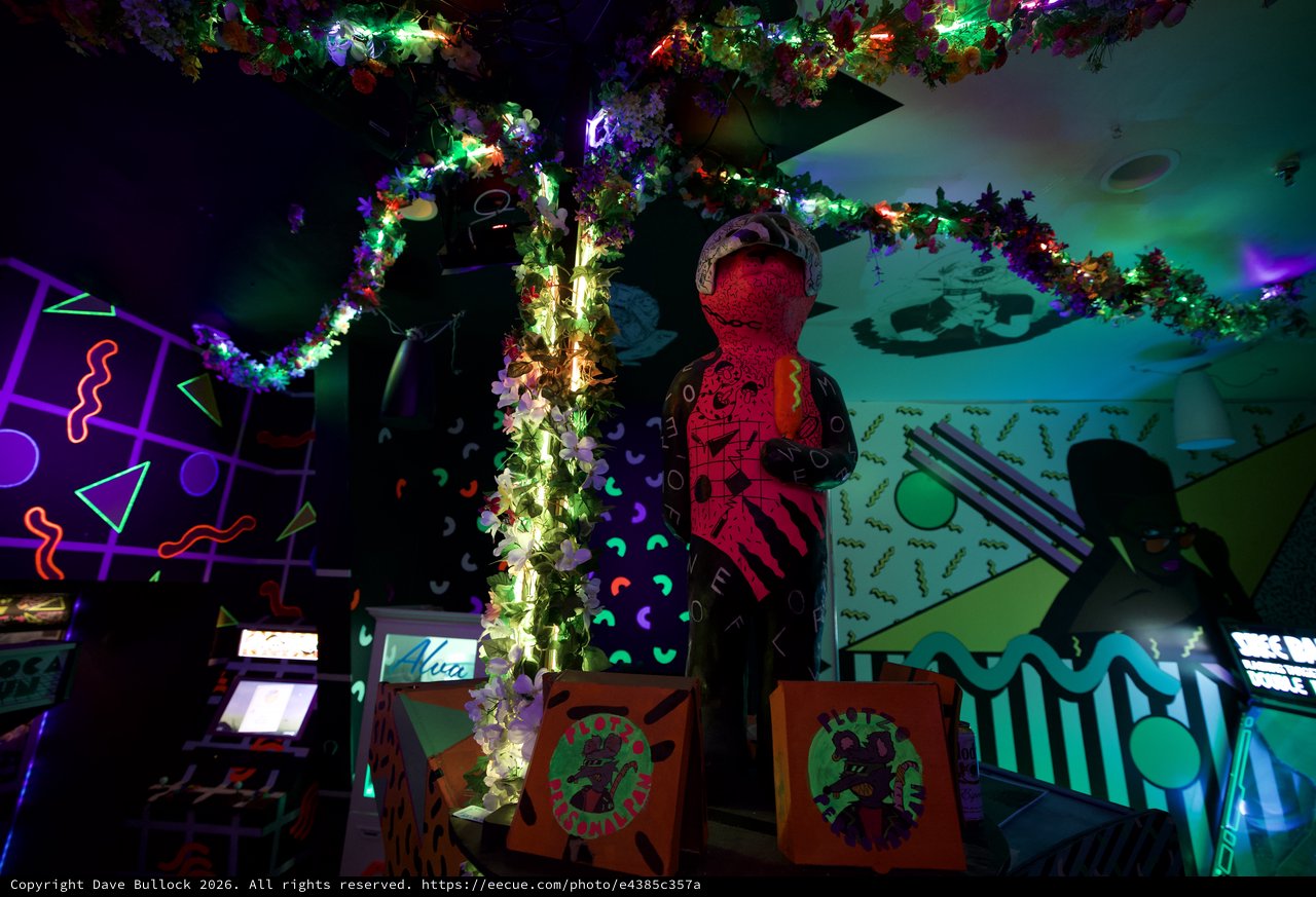 Vibrant 90s-Style Neon Restaurant Interior with Festive Decorations