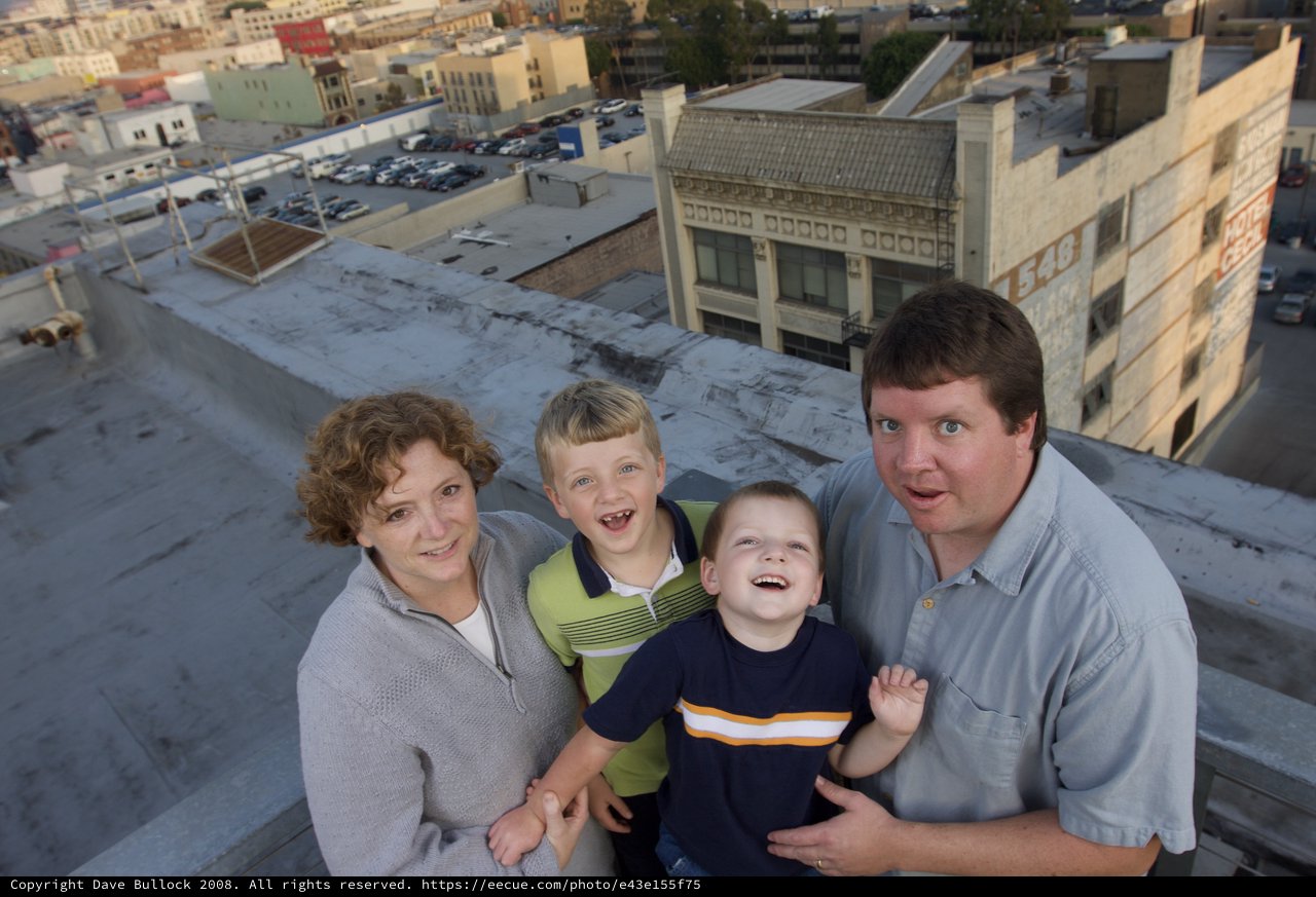 Family Portrait on Urban Rooftop at Dusk