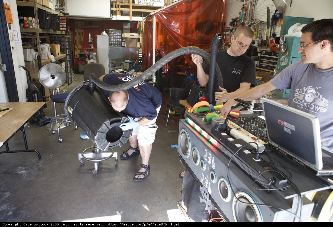 A Blue-Shirted Man in the Manufacturing Workshop