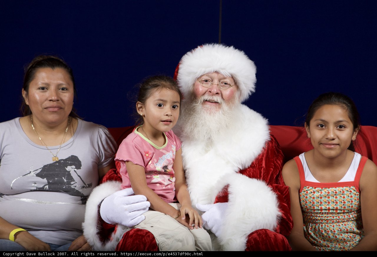 Santa Claus Spreading Joy with Children and Adult