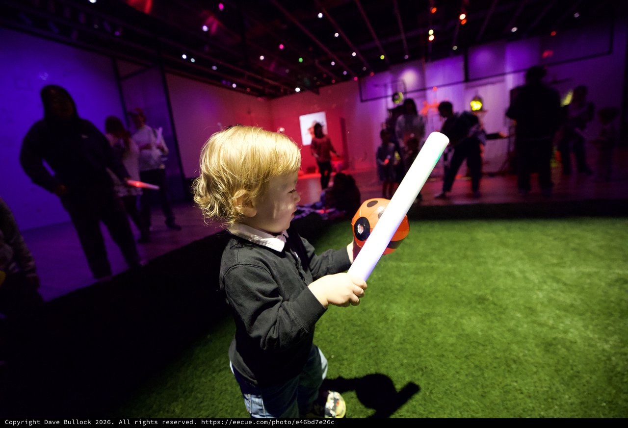 Child with Light Sword at Baby Rave Event