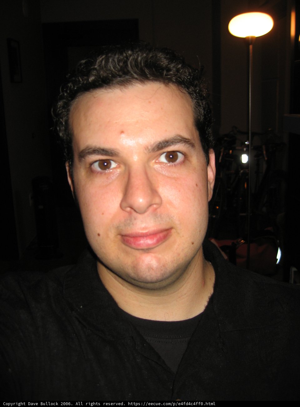 Smiling Man in Black Shirt